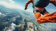 A man wearing an orange suit is skydiving through the air