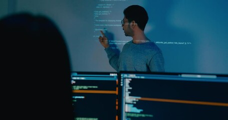 Group adult Asia male software developers mentor leader manager talk strategy plan to executive write prompt AI bot IT app program nomad, video game, designer, data center. Projecting slideshow code.