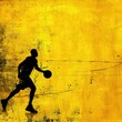 Silhouette of a basketball player on yellow background - Dynamic silhouette of a basketball player in action against a textured yellow backdrop