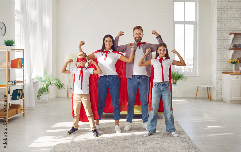 Gathered in the living room, a superhero family with children in ...