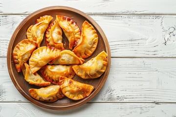 Wall Mural - Homemade fried meat dumplings on wooden table