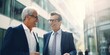 © Budjak Studio - Two businessmen in stylish suits hold negotiations while standing on the street near the office. Generative AI.
