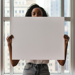 mockup for a large square blank canvas being held by an African American woman