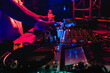 DJ hand on mixing equipment