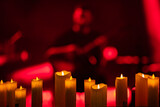 Fototapeta Las - candles on the concert stage background