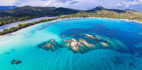 Wall Mural - Best beaches of Corsica island - aerial view of beautiful Santa Giulia long beach with sault lake from one side and turquoise sea from other