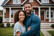Portrait of Happy biracial couple in front of their new house