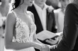 Intimate view of the bride's elegant hands delicately holding her partner's as they exchange heartfelt vows during the ceremony.