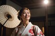 Smiling Woman wearing kimono and looking up at spotlight