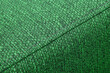 Textured green furniture fabric with stitching