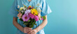 compassionate healthcare professional holding vibrant bouquet of flowers, nurse day concept, copy space for text 