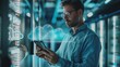 © Prostock-studio - Man Analyzing Tablet Data in Server Room