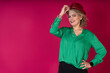 © Ceballos - Woman Wearing Green Shirt and Red Hat