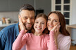 © Prostock-studio - Happy family posing together in kitchen, closeup