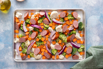 Wall Mural - Sheet pan dinner with sausage and vegetables ready to be roasted