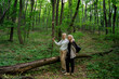 Mother and daughter in forest hiking together 