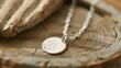 A tiny handprint charm on a mothers necklace captures the precious and everchanging bond between mother and child. .