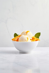 orange ice cream in a white bowl on white marble table with fresh orange slices, summer dessert idea