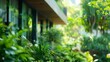 Defocused image of a sustainable building with lush greeneryfilled surroundings symbolizing the harmonious coexistence of nature and humanmade structures. .