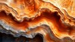 Abstract Wavy Rock Formation in Warm Brown and Orange Hues for Artistic Background Use