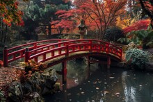 Autumnal Red Bridge Over A Tranquil Pond - Lush Autumn Scene Featuring A Curved Red Bridge Over A Peaceful Pond Surrounded By Vibrant Foliage