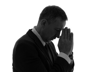 Poster - Silhouette of mature businessman praying on white background, closeup