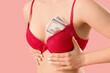 © Pixel-Shot - Sexy young woman in underwear with dollar banknotes on pink background, closeup. Sex for money concept