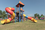 Fototapeta Las - Playground in the park with blue sky