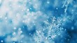 Soft, blurred abstract snowflakes against a cool blue background, symbolizing gentle snowfall. 