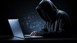 An incognito person in a hoodie uses a laptop in the dark, with digital data glowing in the background, depicting online anonymity.
