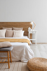 Wall Mural - Interior of light bedroom with big bed, pillows and bedside tables