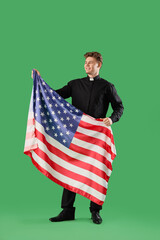 Sticker - Male priest with USA flag on green background