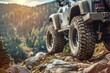 © mila103 - A rugged off-road vehicle navigating a rocky trail.