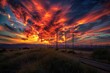 Dramatic sunset with fiery clouds above a rural landscape, featuring power lines and a rail track, evoking the end of a day.