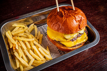 Canvas Print - burger with french fries on metal tray