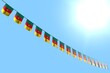 cute many Cameroon flags or banners hanging diagonal on string on blue sky background with bokeh - any holiday flag 3d illustration..