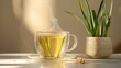 Thai lemon grass tea in a clear glass mug, steam 