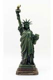 Fototapeta Dziecięca - A detailed replica of the Statue of Liberty with a white background symbolizing freedom and democracy.