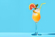 Flat Orange Party Cocktail Over Blue.