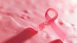 A pink ribbon, a universal symbol of breast cancer awareness, displayed on a white background.