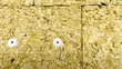 Combustible stone mineral wool close-up on the wall. Concept of construction and insulation of premises. Fibrous building material close-up. Concept of insulation and sound insulation of residential.