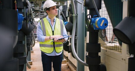 Poster - Civil engineer manager checking industry cooling air conditioner water cooling tower air chiller of large industrial building to control air system at construction site