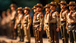 A toy figure group of boy scouts walking in forest.