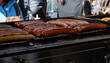 German street food on Portobello road Saturday food market, London, Uk, many BBQ grilled sausages ready to eat in outdoor café
