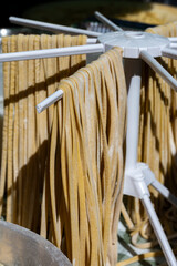 Wall Mural - Italian food, fresh homemade pasta tagliatelle ready to cook on Portobello road food market, London