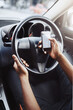 Danger, texting and driving with hands of person on steering wheel with scroll, phone and risk. Road safety, awareness and driver in car with smartphone, distraction and attention with auto insurance