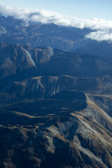 Wall Mural - Blick aus dem Flugzeug von Oben auf Berge bei Milford Sound in Neusseeland