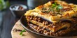 Mouth-watering lasagna layers filled with cheese, meat sauce, and topped with herbs
