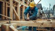 Carpenter constructing wooden framework at construction site