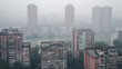 Aerial view urban cityscape with thick pm 2.5 pollution smog fog covering city high-rise buildings by river